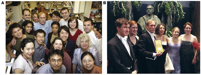 Peter with his lab and his family.
(A) The Agre lab on October 8, 2003. ...